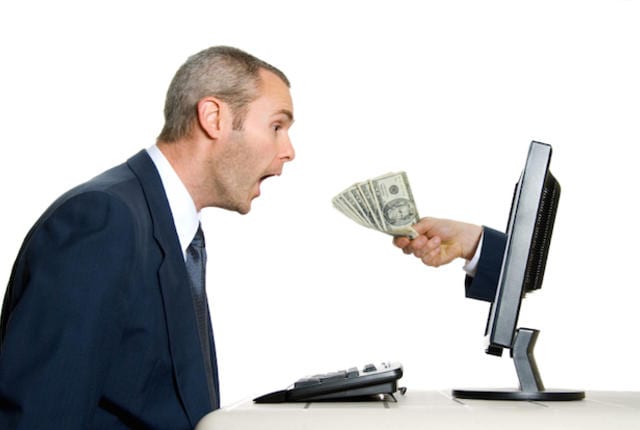 surprised man getting money from the internet
